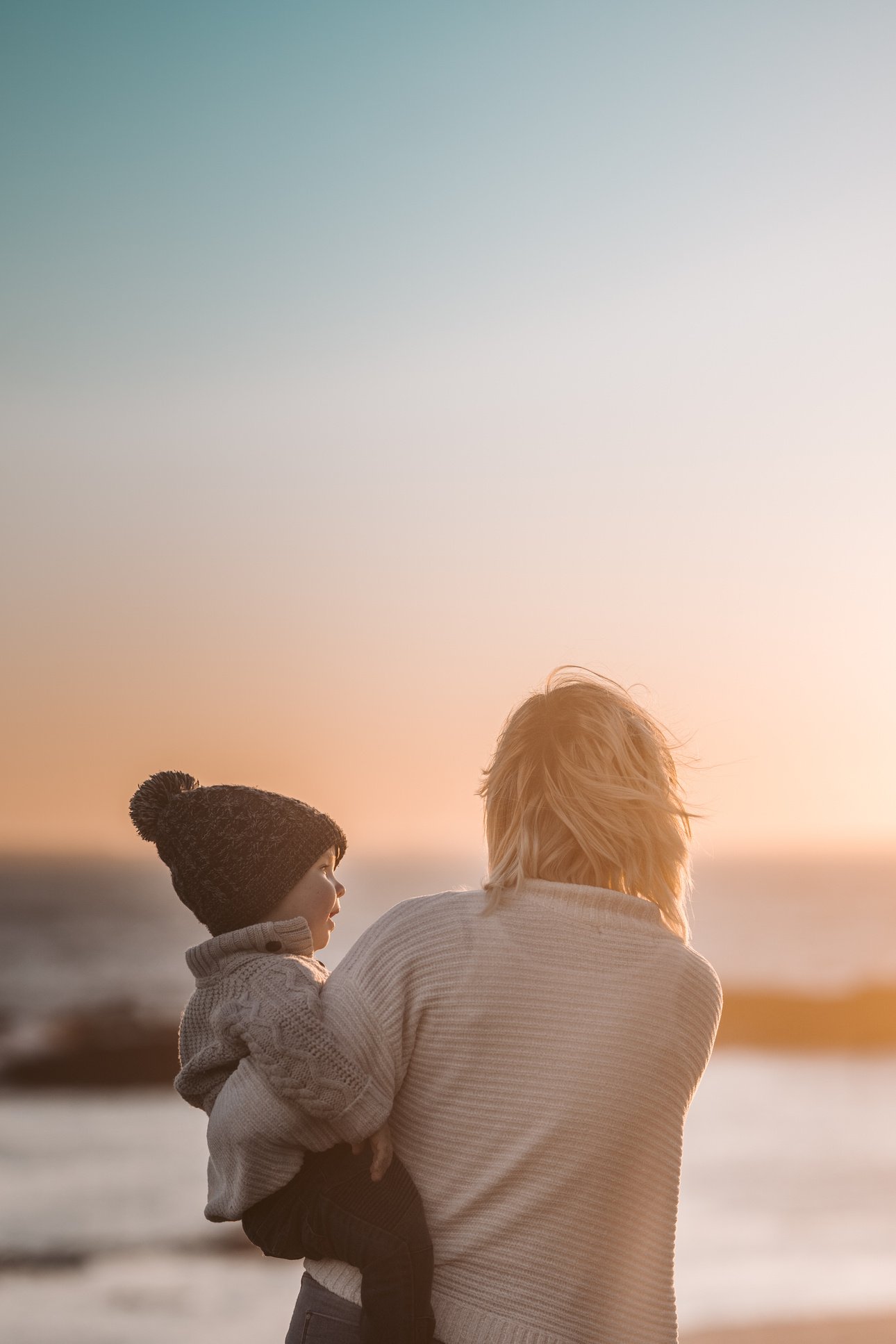 Photo Of Woman Carrying Child 